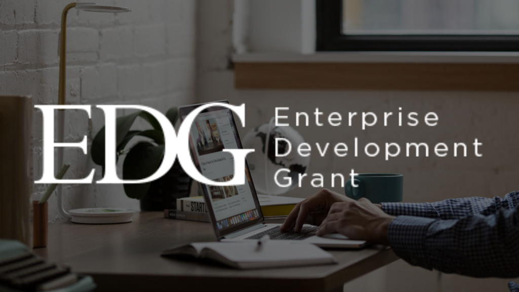 A team discussing the application process for the Enterprise Development Grant (EDG) to support business growth.